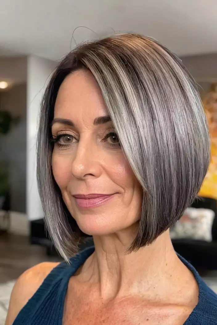 A photo of a 40-year-old Heather, inverted bob for thick hair, living room background  