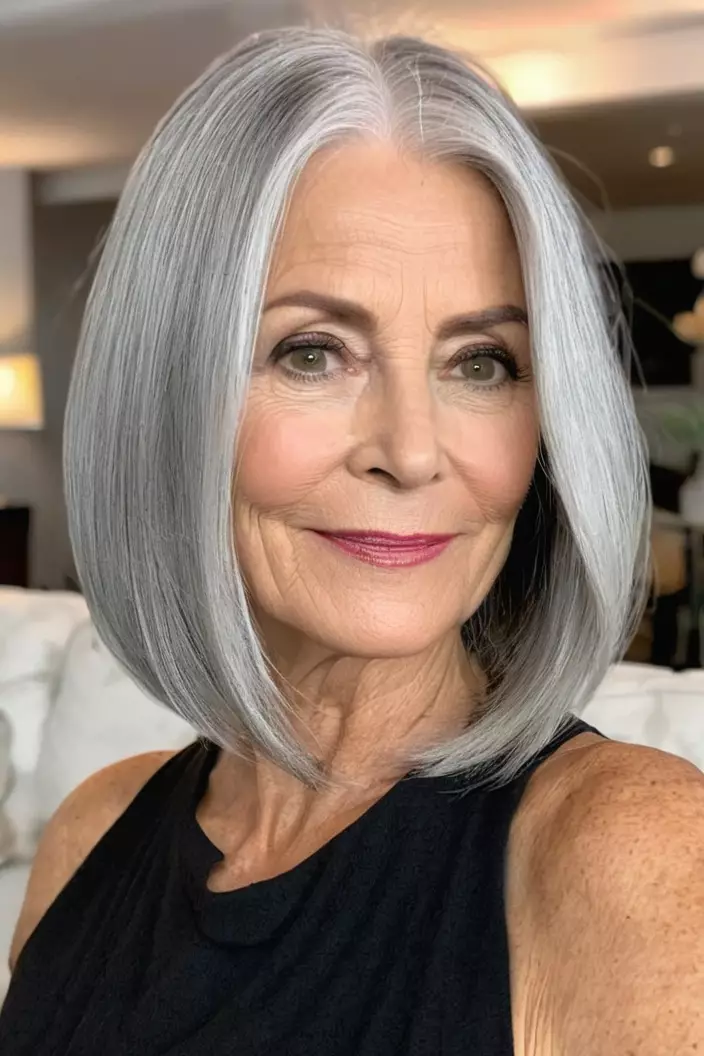A photo of a 58-year-old Karen, sleek silver lob, front view, living room background  