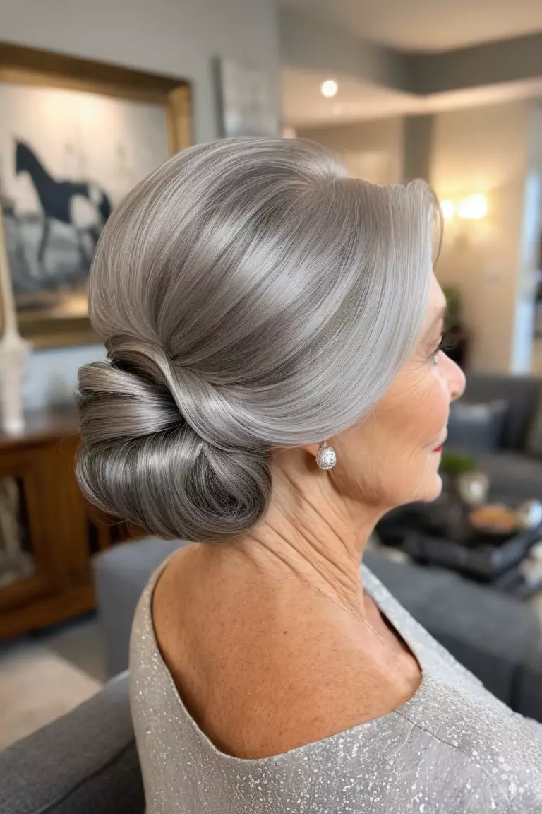 A photo of a 75-year-old Stephanie, low side-swept silver chignon, side view, living room background