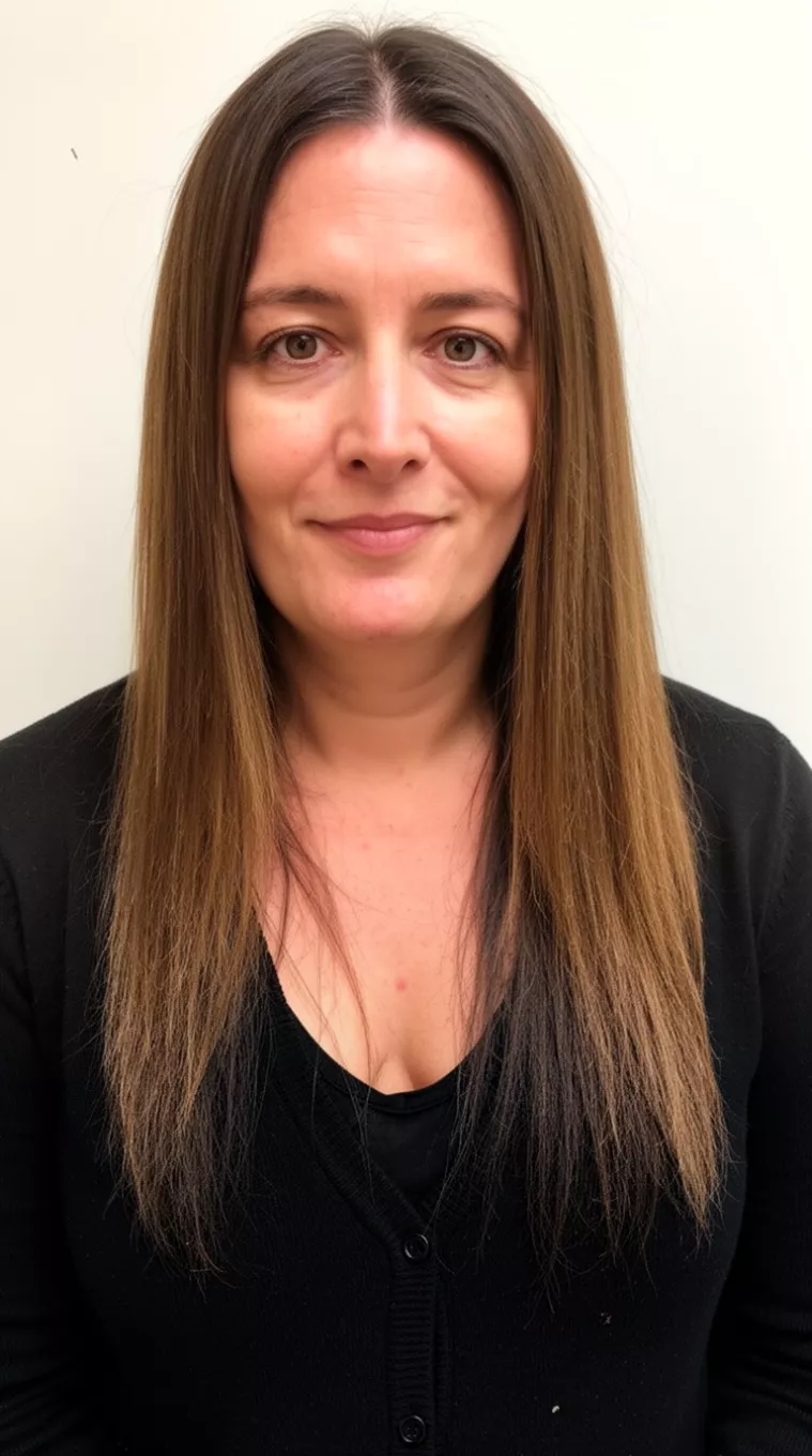 casual photo of a 35-year-old woman wearing a black cardigan with a dirty brunette colored long straight hairstyle