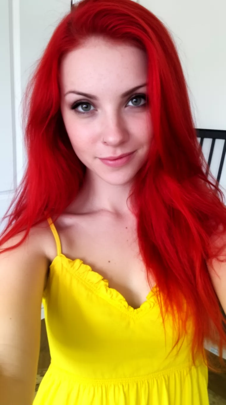 [selfie] of a 26-year-old woman wearing a yellow sundress with a Fiery Ginger Spice colored long hairstyle, minimal background