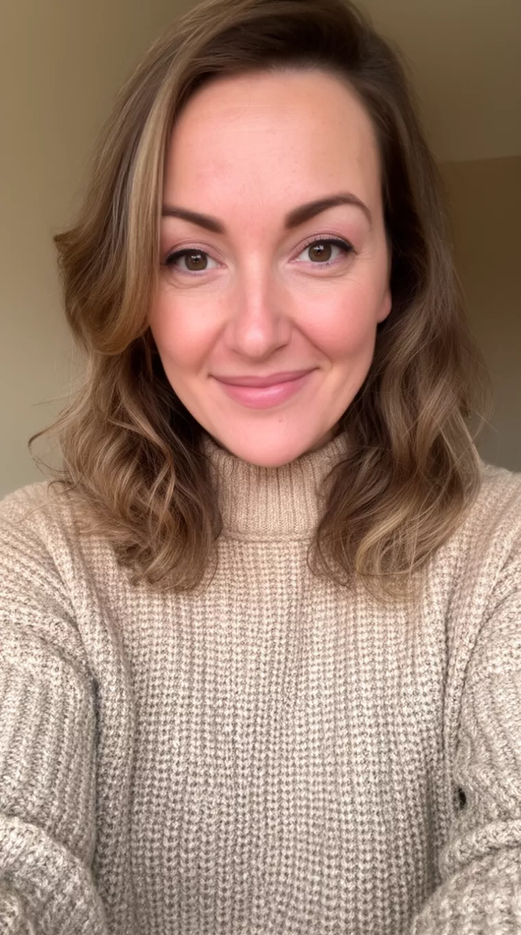 selfie of a 36-year-old woman wearing a beige knit sweater with Color Melting