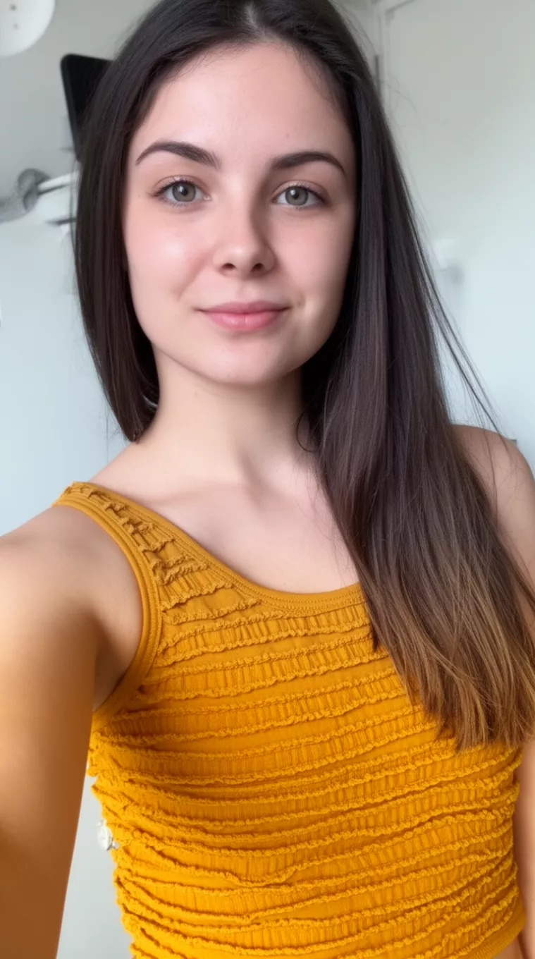 selfie of a 22-year-old woman wearing a mustard yellow tank top with Textured Layers