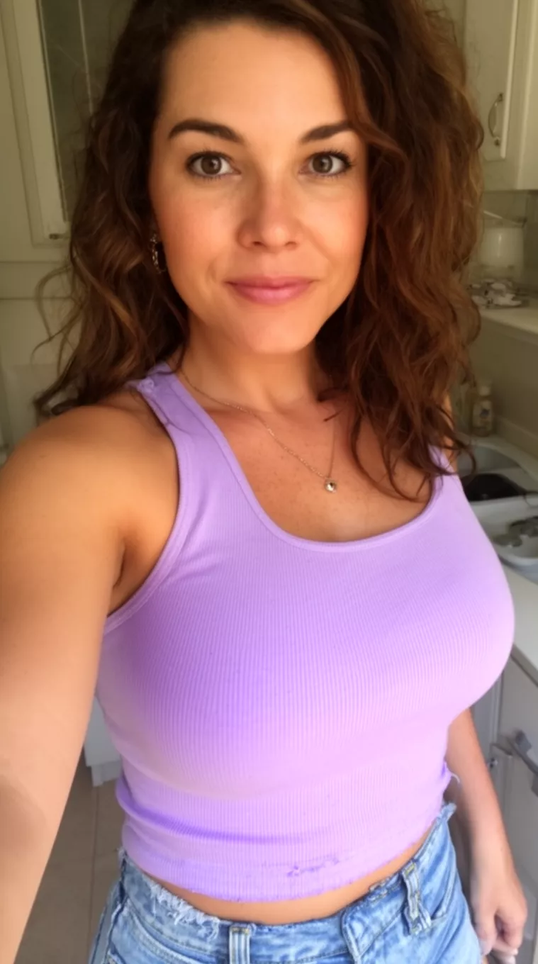 selfie of a 30-year-old woman wearing a lavender ribbed tank top with a Grown Out Crop