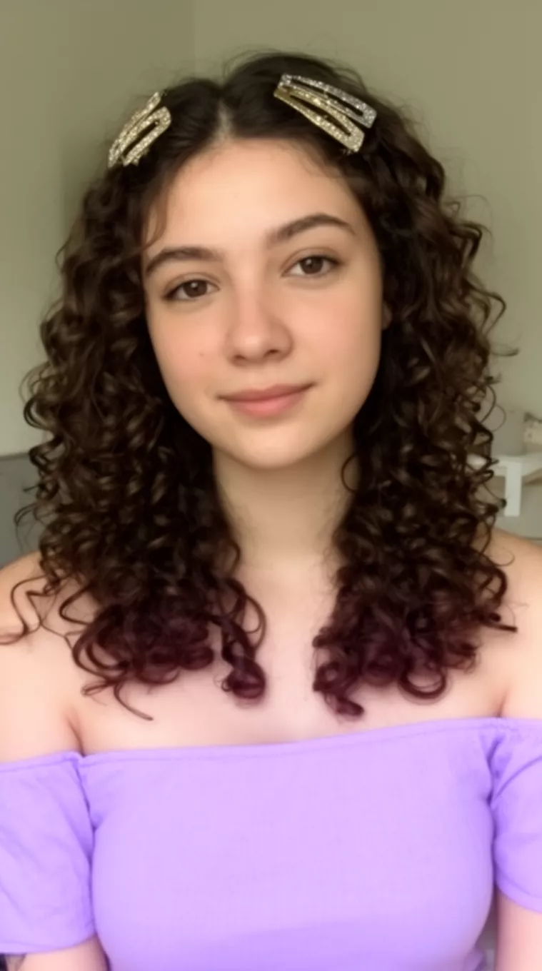 casual close-up photo of a 26-year-old woman wearing a light purple off-the-shoulder top with dark brown voluminous ringlets and barrettes, minimal background