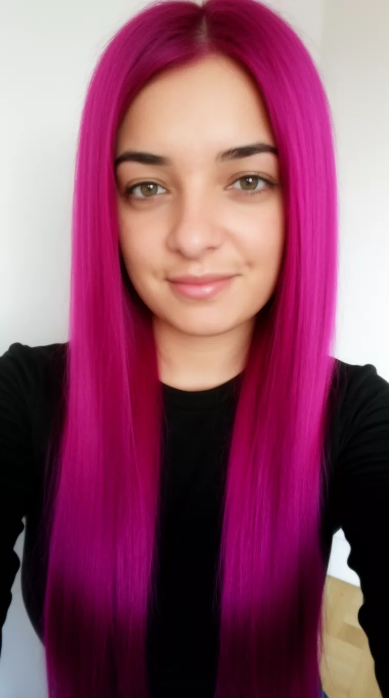 selfie of a 31-year-old woman wearing a black top with a vibrant magenta colored long straight hairstyle, front view, minimal background.